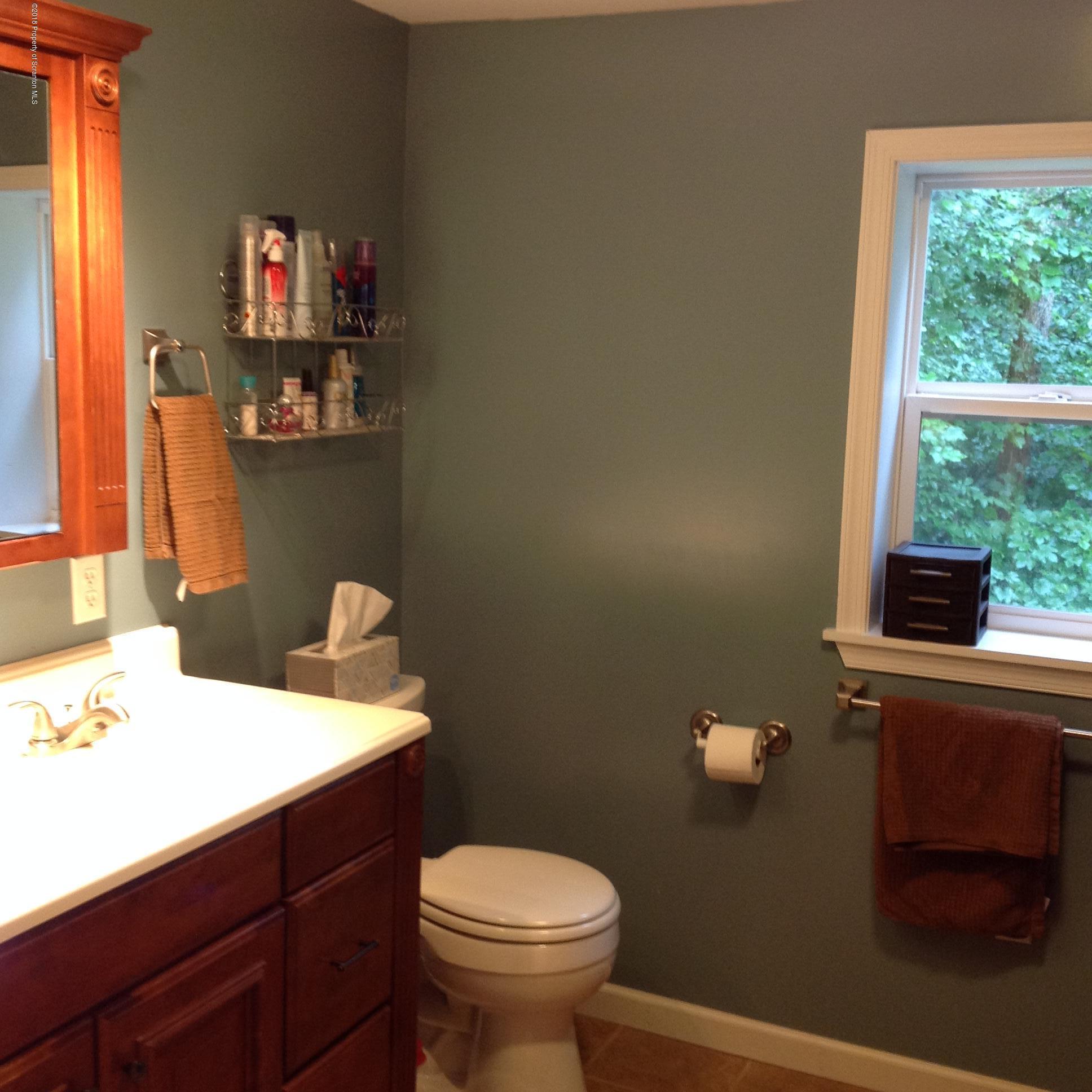 153 Country Road Falls, PA 18615 - Photo 8 of 15 a bathroom with a sink a toilet and a window