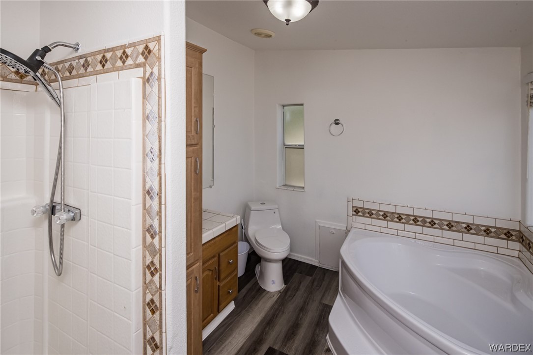 1949 Growler Road Golden Valley, AZ 86413 - Photo 30 of 87 a bathroom with a toilet and a shower