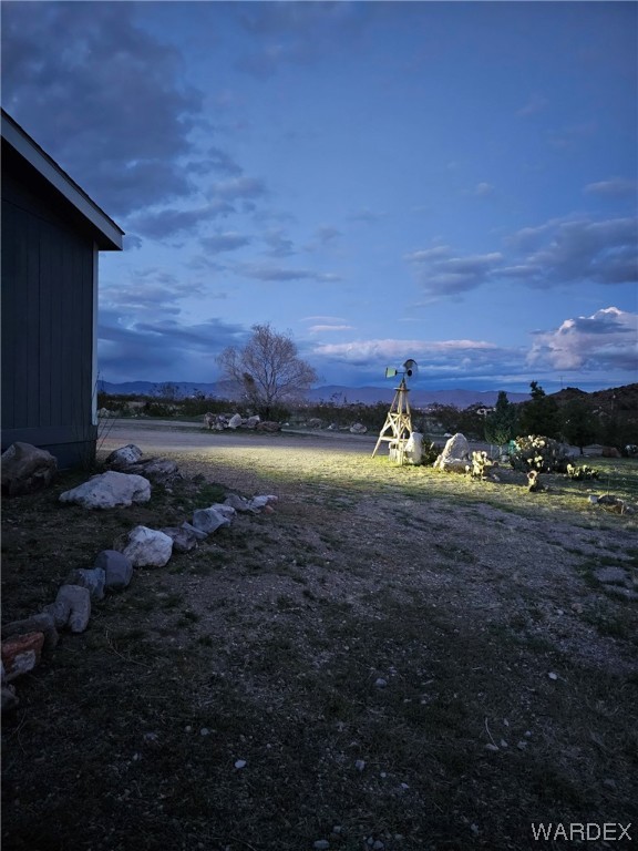 1949 Growler Road Golden Valley, AZ 86413 - Photo 82 of 87 a view of a backyard of a house