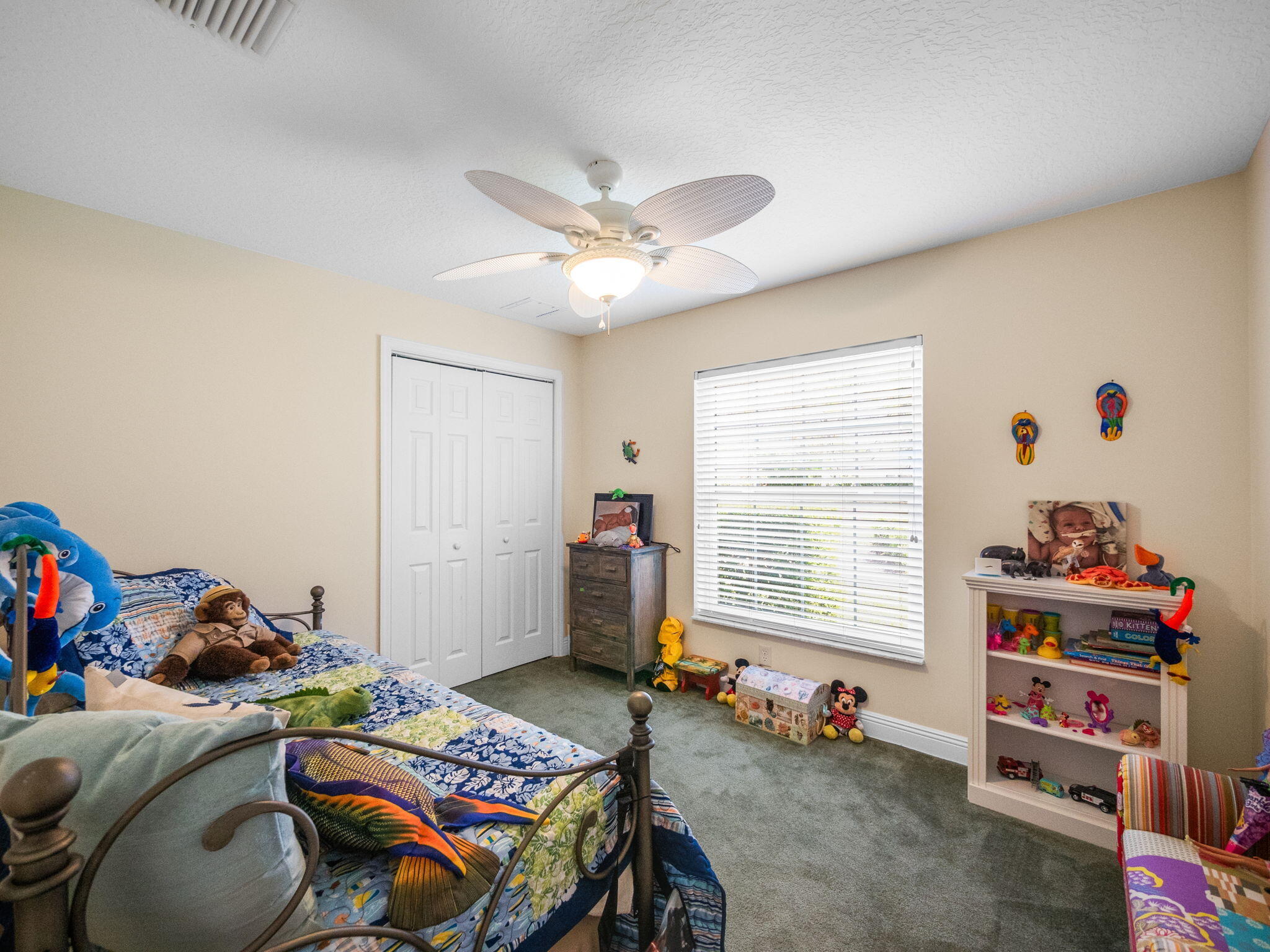 204 Clocktower Drive Jupiter, FL 33458 - Photo 12 of 21 a bedroom with a bed and a window