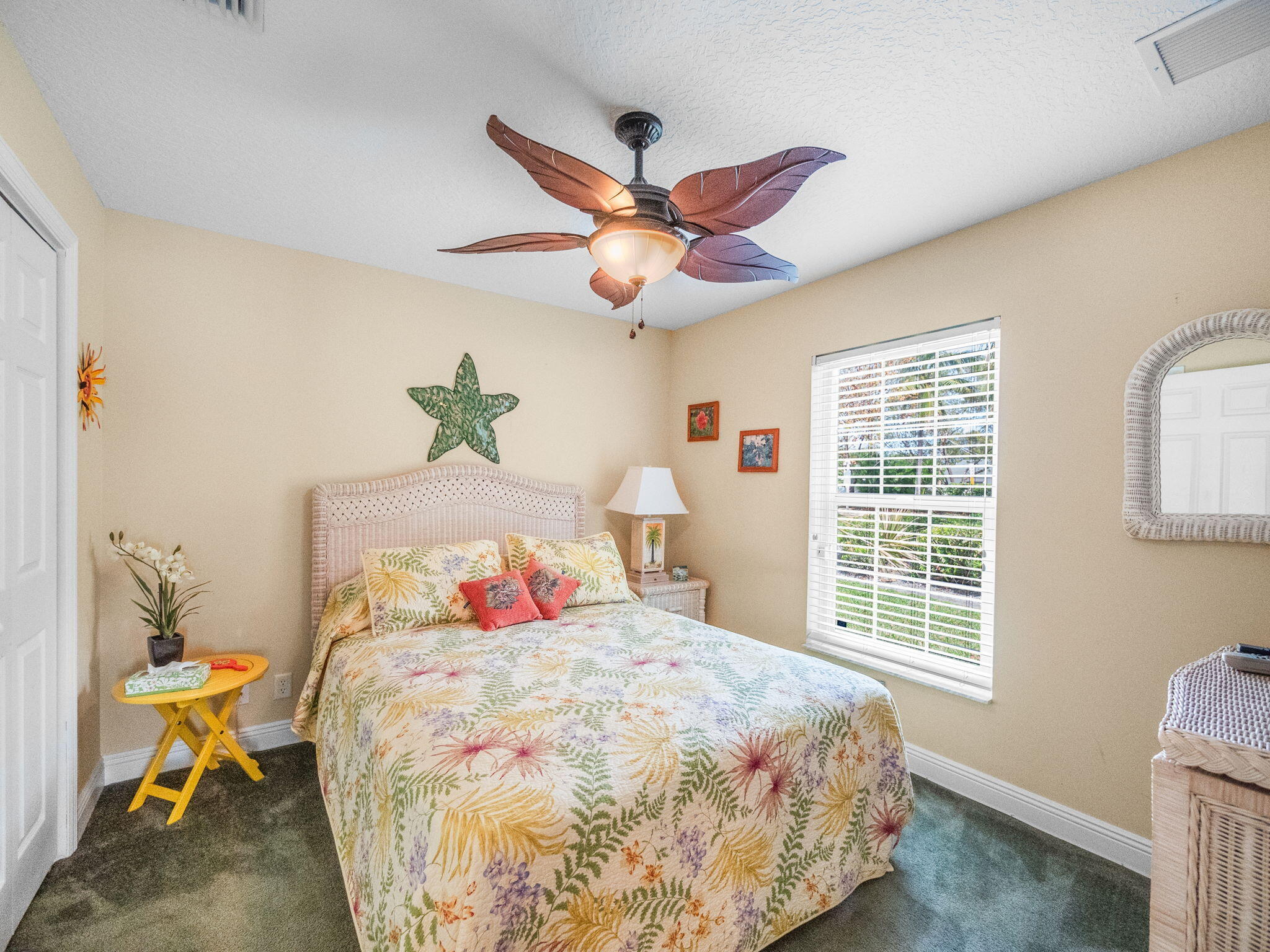 204 Clocktower Drive Jupiter, FL 33458 - Photo 13 of 21 a bedroom with a bed and a chandelier