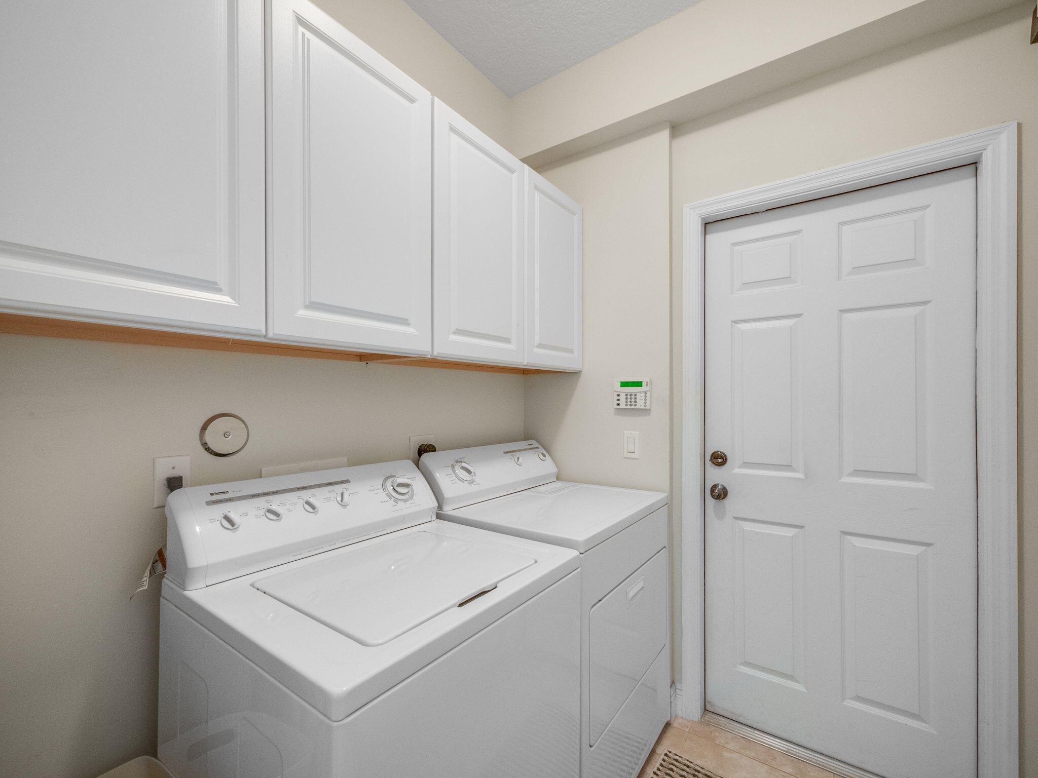 204 Clocktower Drive Jupiter, FL 33458 - Photo 16 of 21 a utility room with dryer and washer