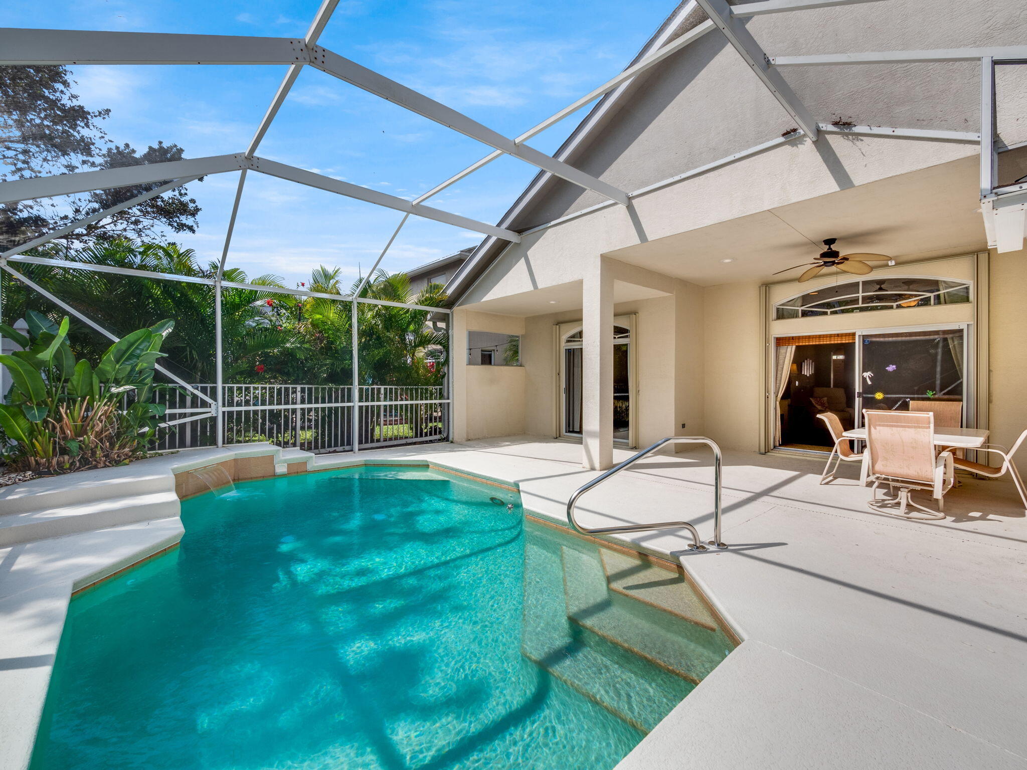 204 Clocktower Drive Jupiter, FL 33458 - Photo 19 of 21 a view of a chair and tables in patio