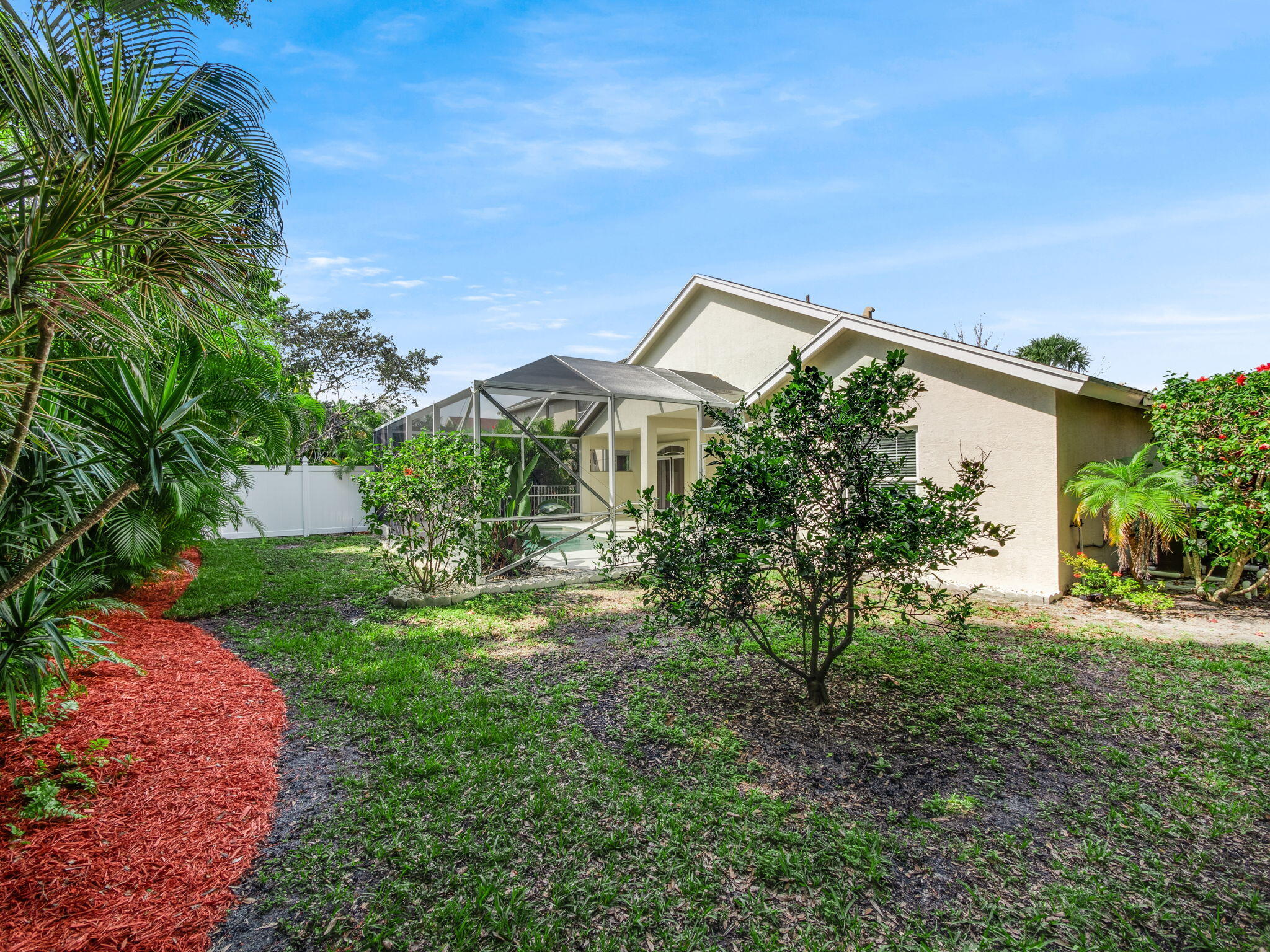 204 Clocktower Drive Jupiter, FL 33458 - Photo 20 of 21 a front view of a house with garden