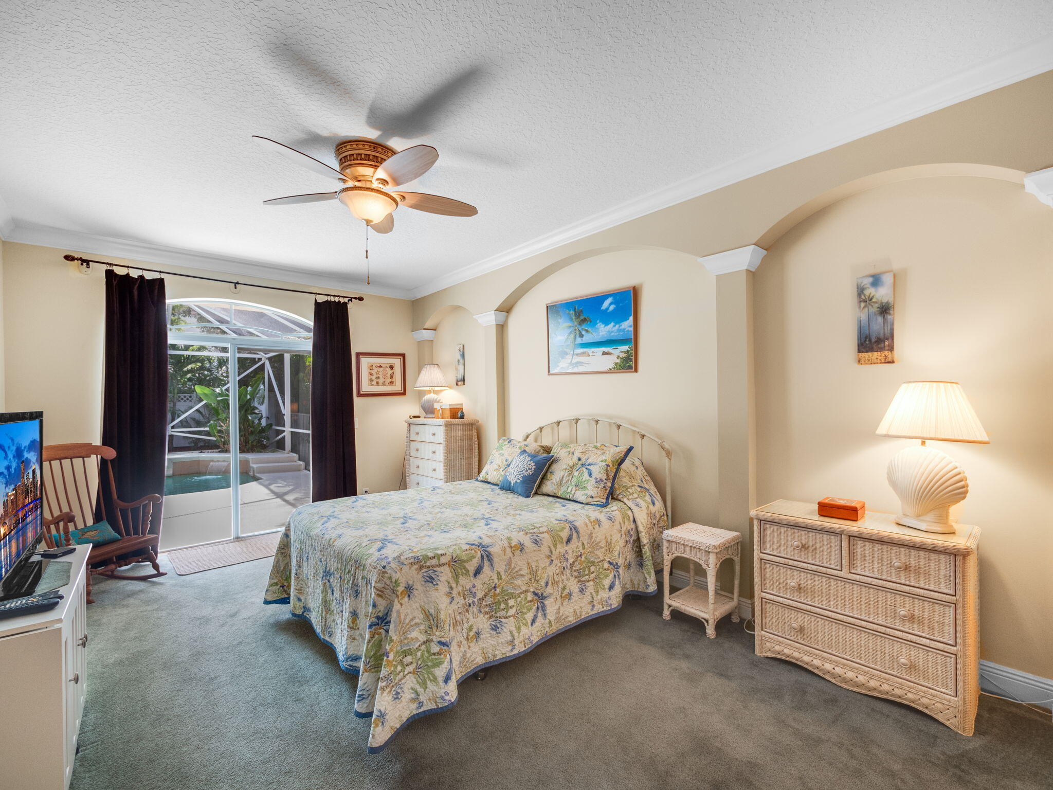 204 Clocktower Drive Jupiter, FL 33458 - Photo 10 of 21 a bedroom with a bed and a chandelier