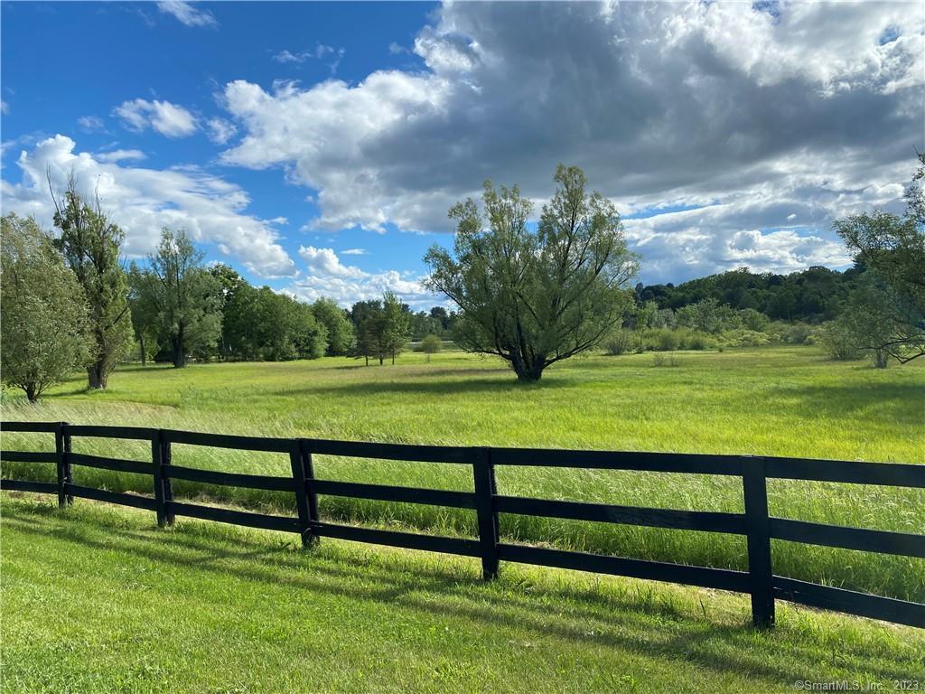 55 Still Meadow Road Sharon, CT 06069 - Photo 11 of 22 a view of a golf course with a lake
