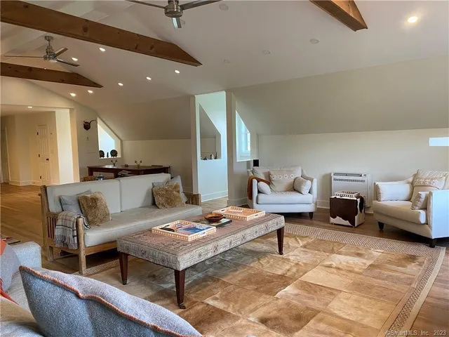 a living room with furniture and a table