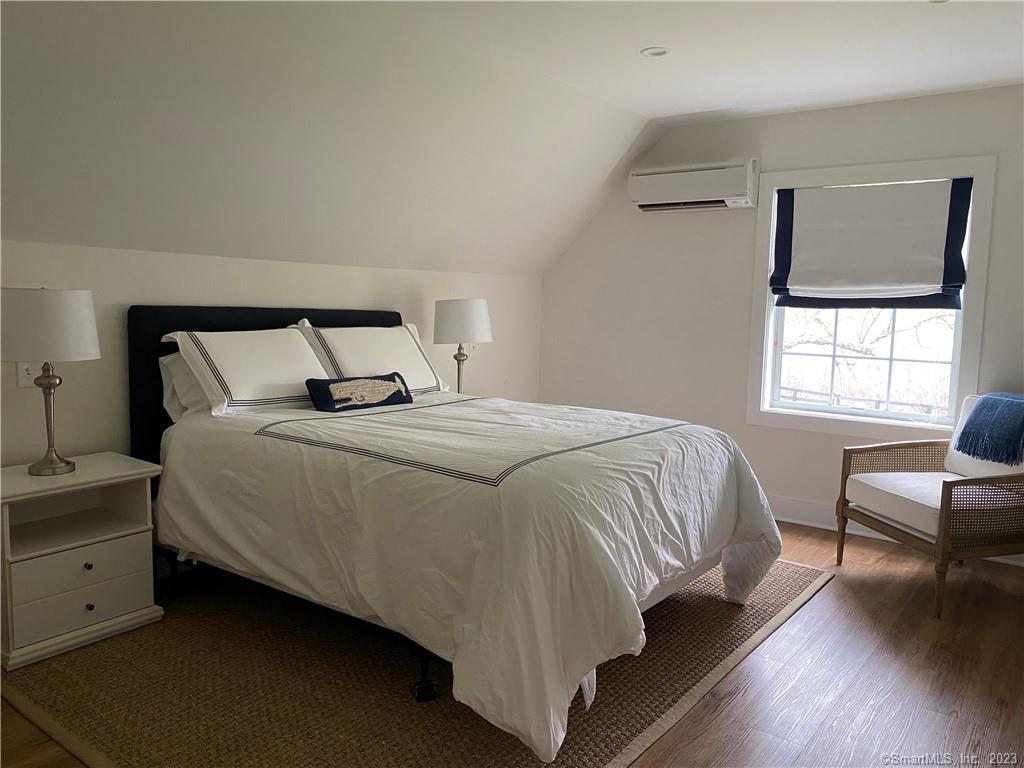 55 Still Meadow Road Sharon, CT 06069 - Photo 2 of 22 a bedroom with a bed and wooden floor