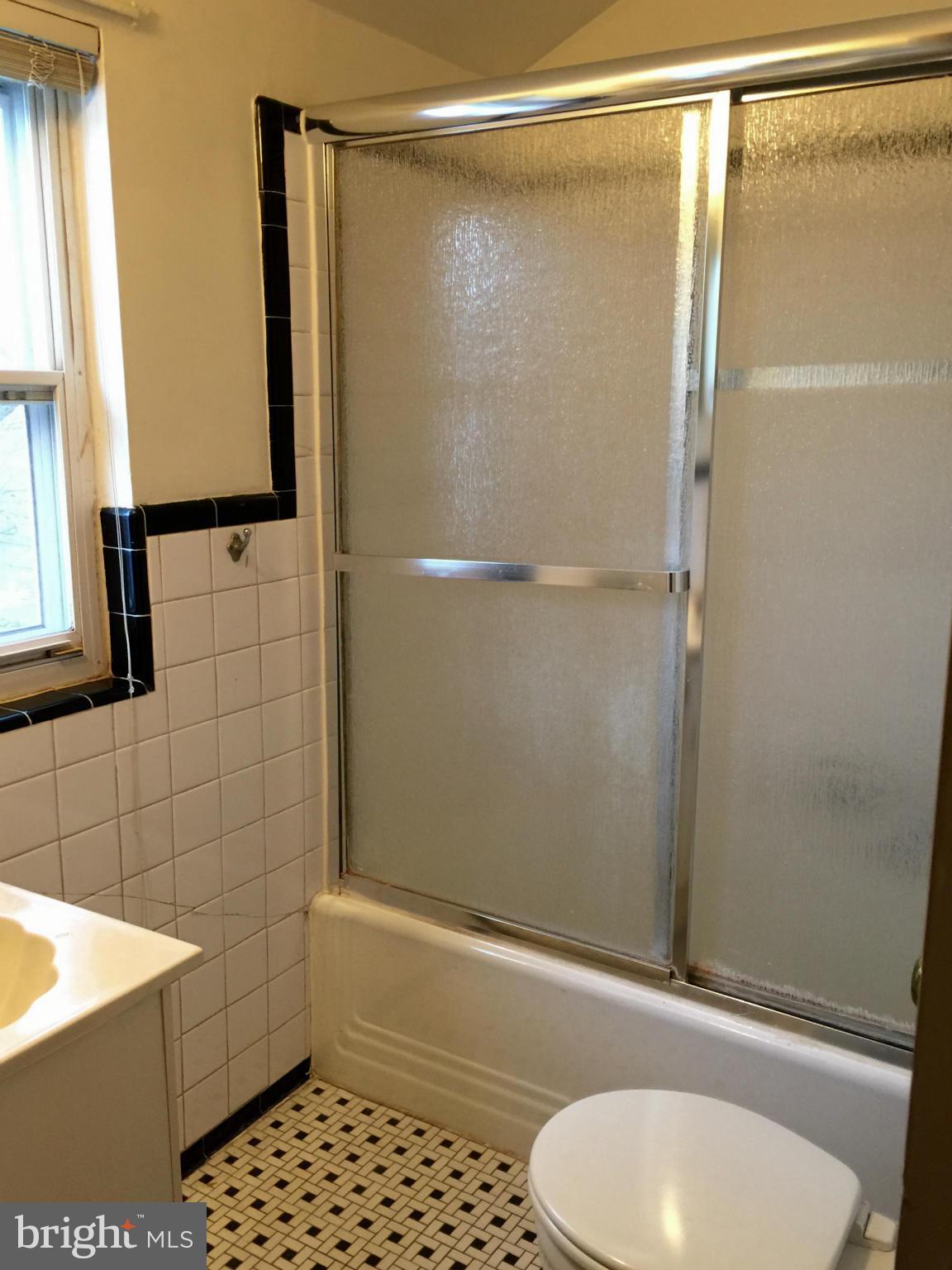 4915 Redford Road Bethesda, MD 20816 - Photo 12 of 15 a bathroom with a sink and a mirror