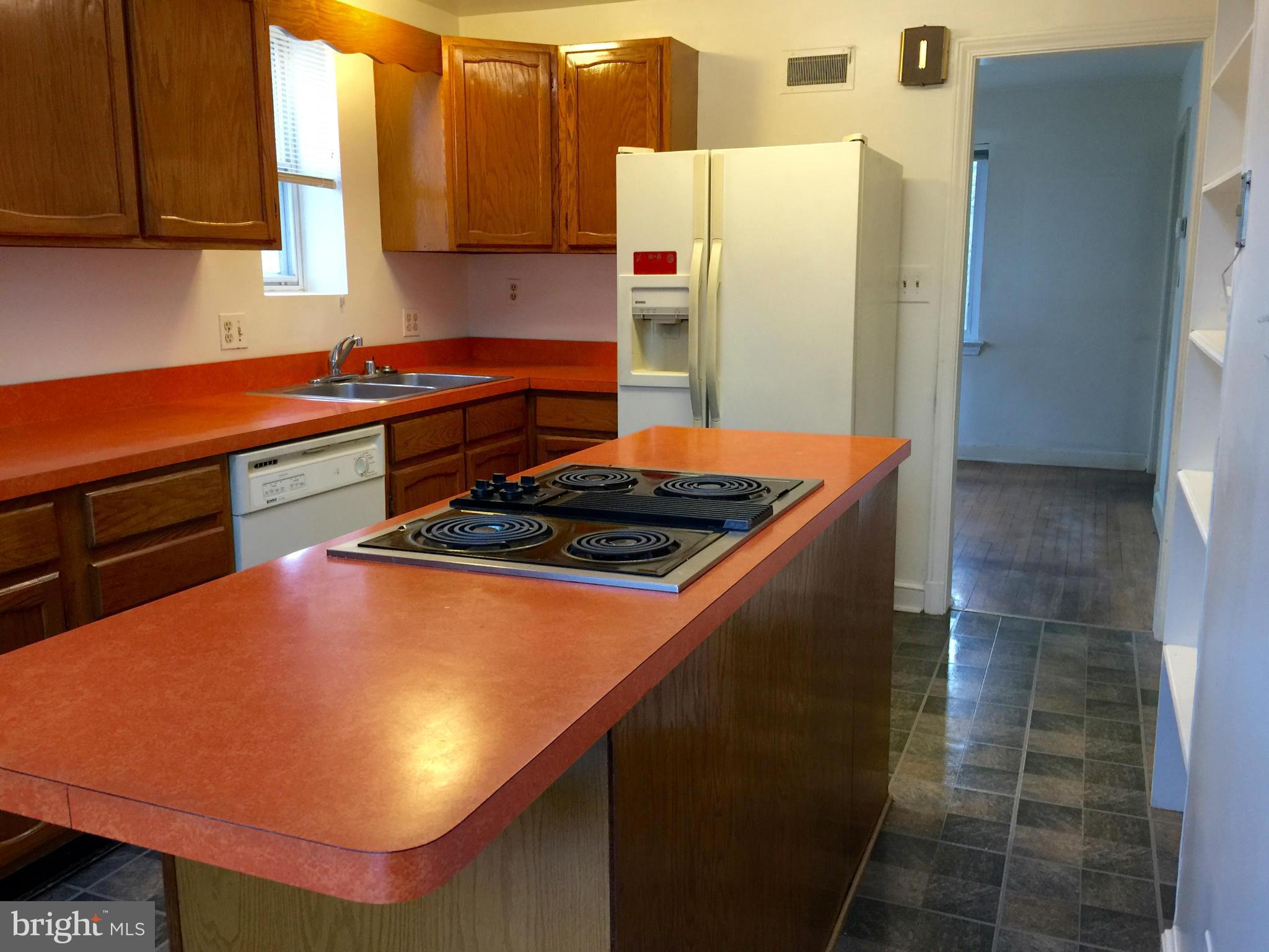 4915 Redford Road Bethesda, MD 20816 - Photo 8 of 15 a kitchen with stainless steel appliances a refrigerator and a stove
