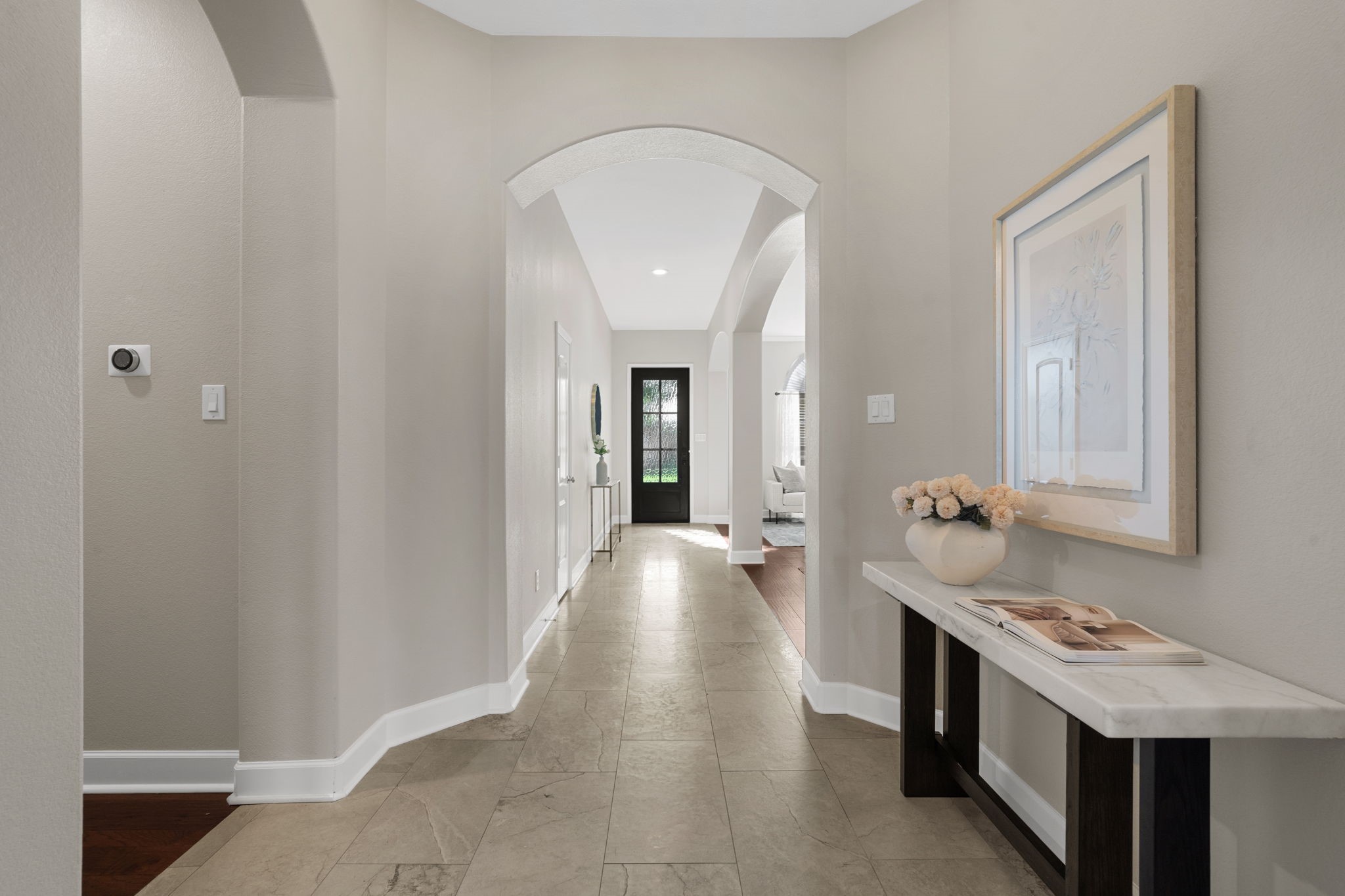 3426 Summer Ranch Drive Katy, TX 77494 - Photo 8 of 48 The extended foyer highlights beautiful flooring, soft designer tones, and a long, welcoming hallway that guides you effortlessly into the heart of the home.