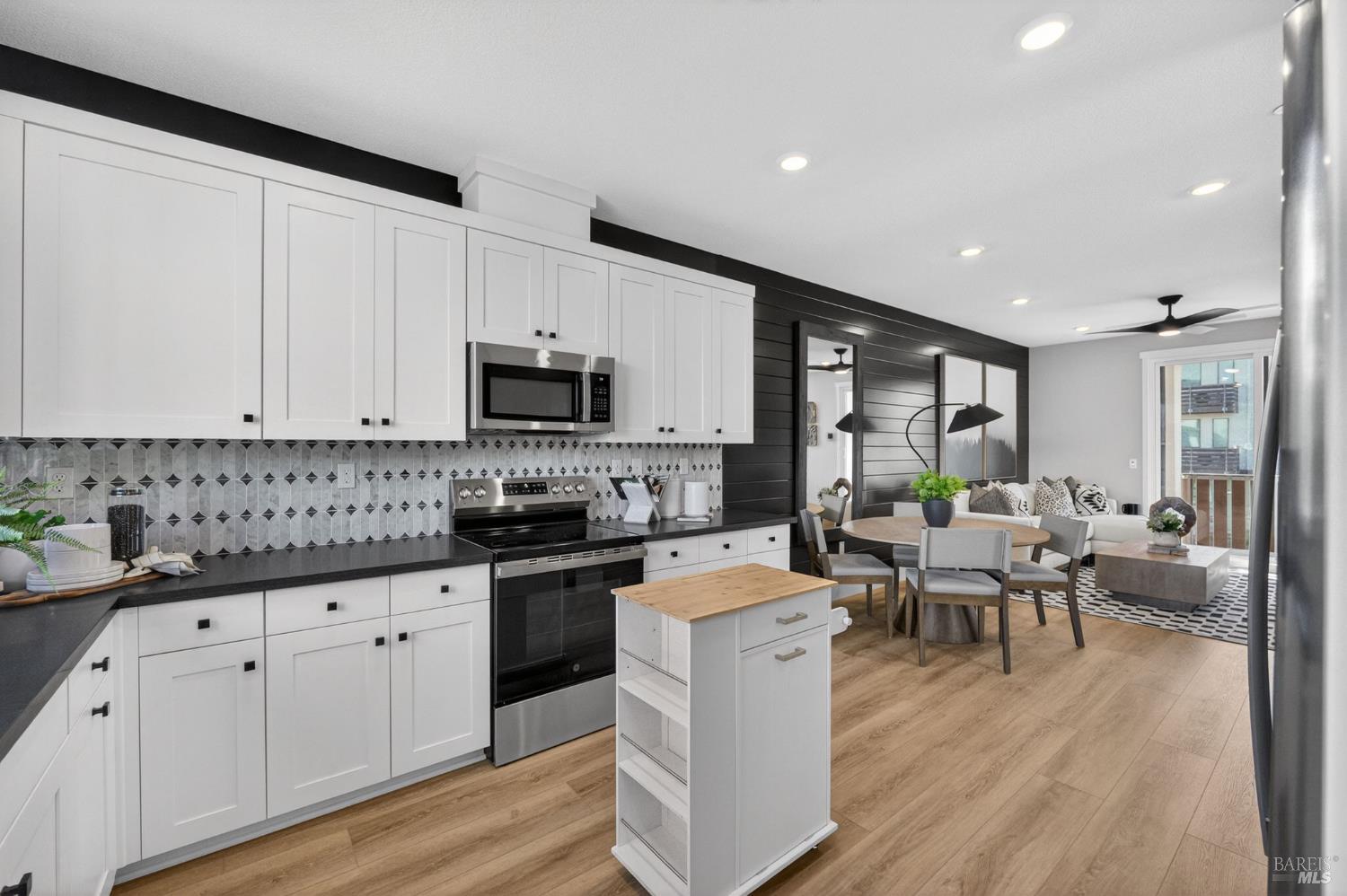 2811 Triad Place Livermore, CA 94551 - Photo 6 of 17 a large white kitchen with lots of counter space a sink and appliances