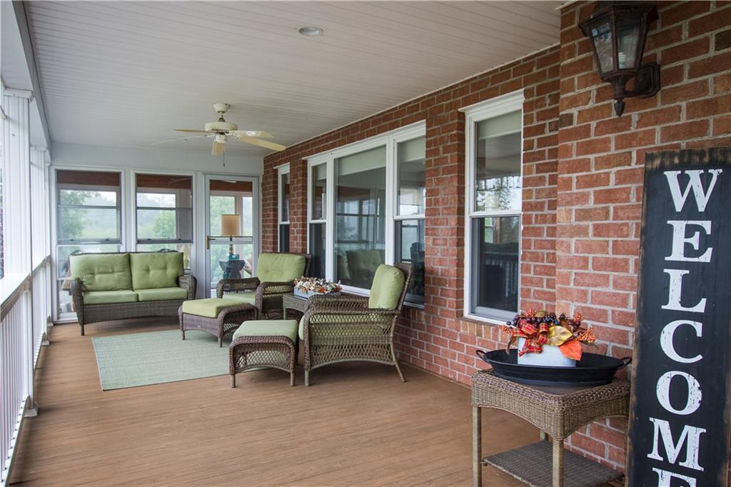 160 Eberle Road Hickory, PA 15340 - Photo 11 of 25 Full length Front porch w/tons of room for your furniture, doors lead to the Florida room.