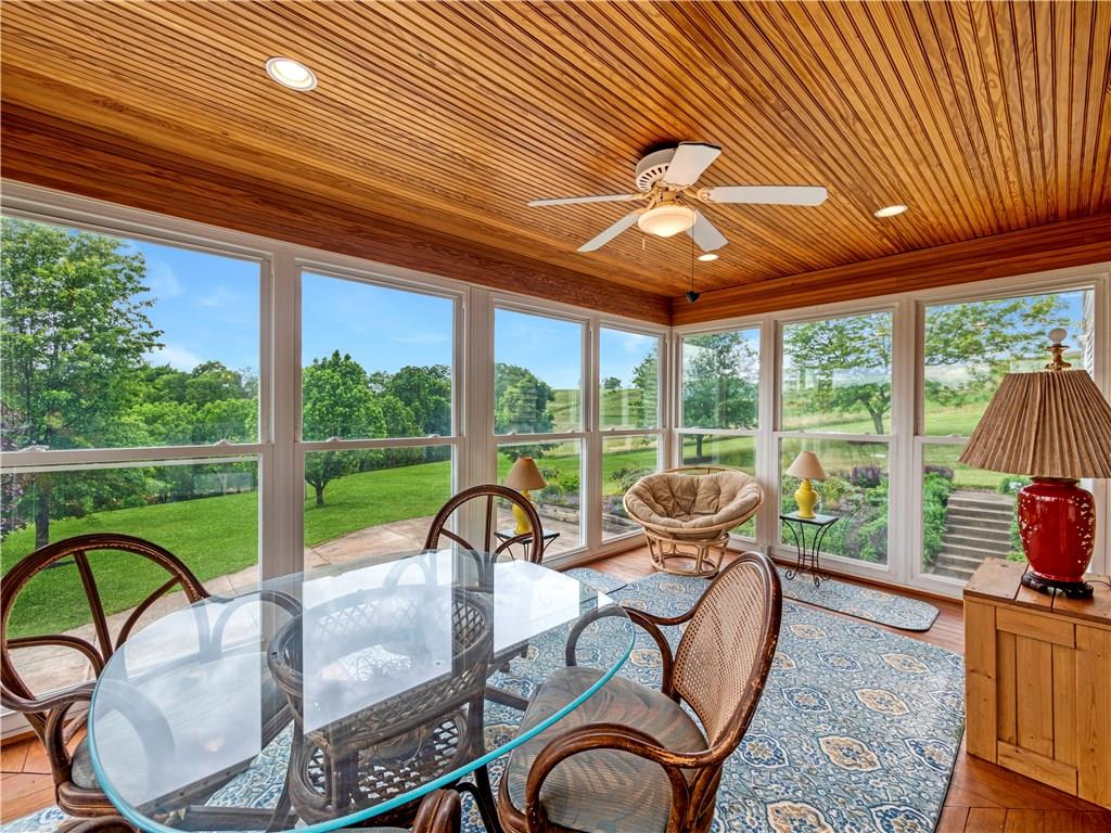 160 Eberle Road Hickory, PA 15340 - Photo 18 of 25 Beautiful Florida Room w/ all windows that looks out over the property & lake. Hardwood flooring and Beadboard ceiling adds to the charm! OPEN the windows and soak in the country air!