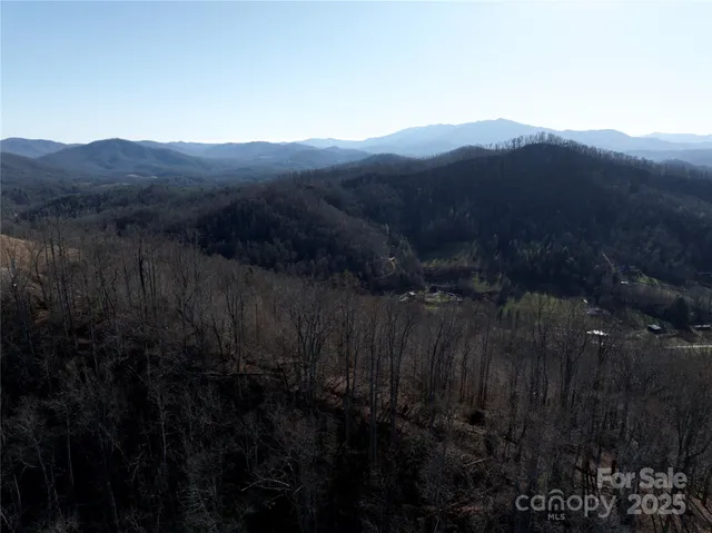a view of a house with a field