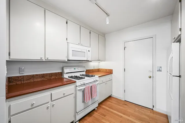 a kitchen with granite countertop a sink and a window