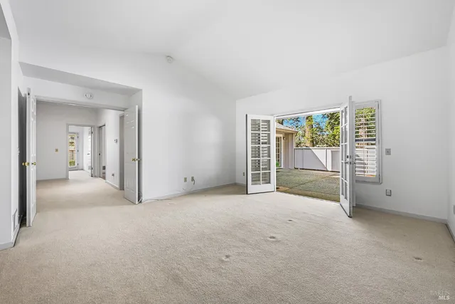 a bathroom with a granite countertop sink a toilet and a shower
