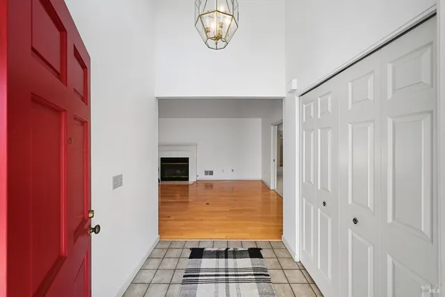 a view of a closet area with mirror