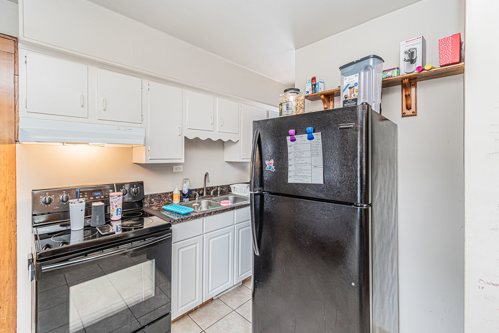 633 Chester Avenue Elgin, IL 60120 - Photo 13 of 29 a kitchen with stainless steel appliances granite countertop a refrigerator and a stove