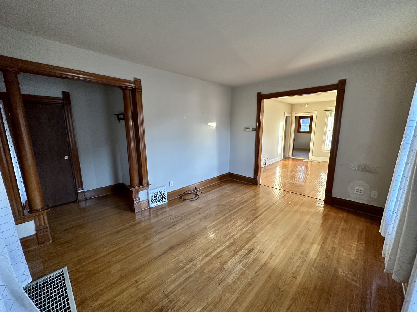 633 Chester Avenue Elgin, IL 60120 - Photo 5 of 29 wooden floor in an empty room with a window
