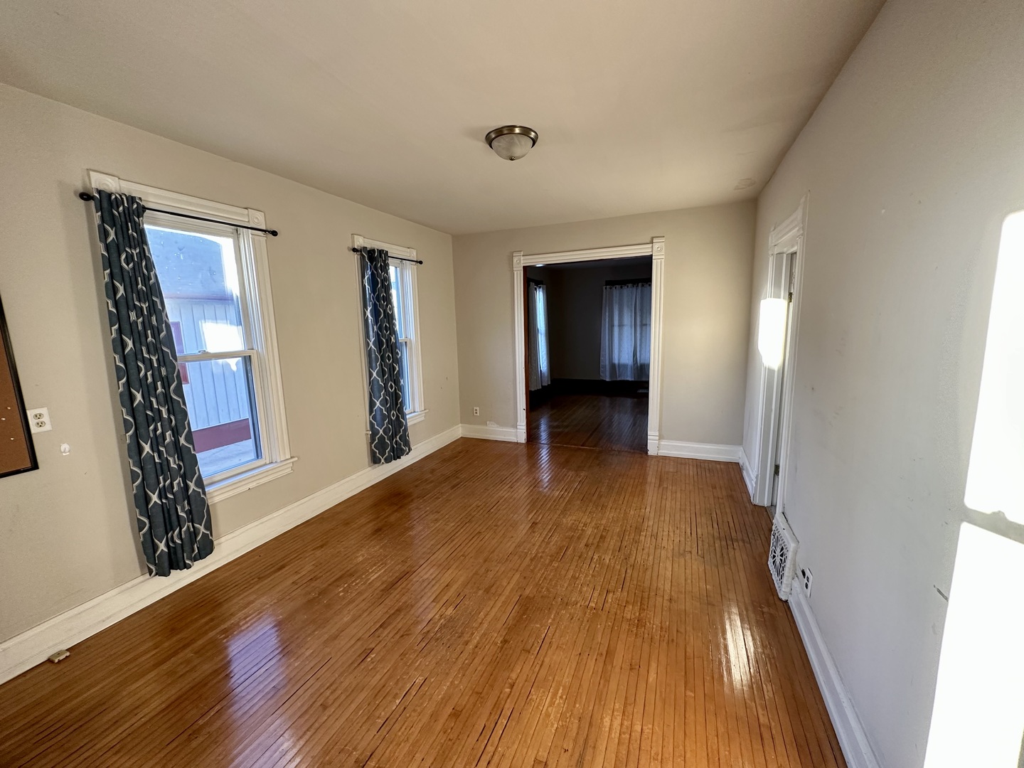 633 Chester Avenue Elgin, IL 60120 - Photo 7 of 29 a view of a room with wooden floor and a window