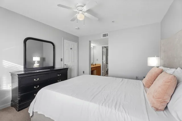 a bedroom with a bed and a dresser