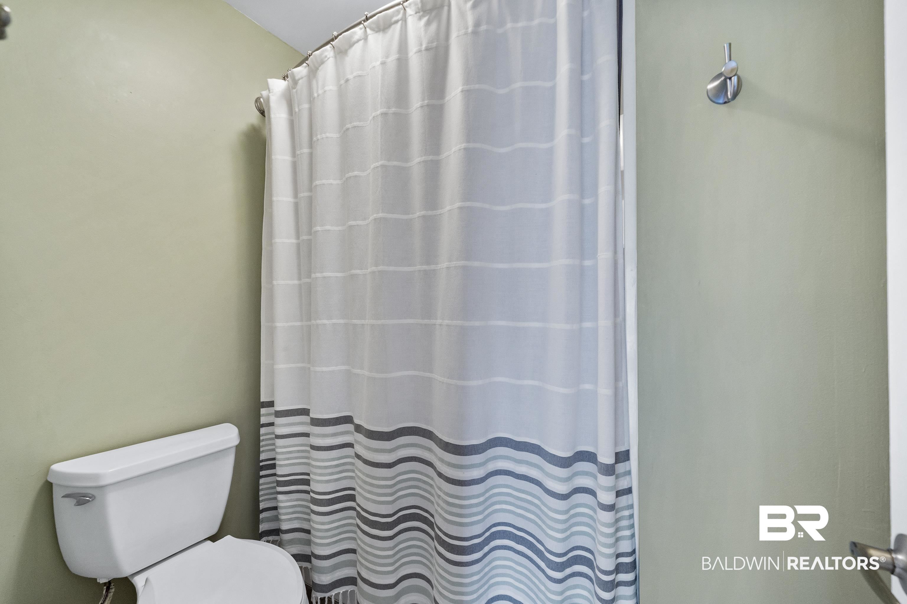 1701 Regency Road, Unit 111 Gulf Shores, AL 36542 - Photo 17 of 29 Bathroom featuring toilet and walk in shower