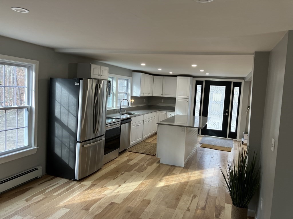 357 Brooks Road Athol, MA 01331 - Photo 3 of 13 a kitchen with a refrigerator and a sink