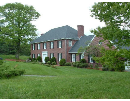 249 Rice Road Wayland, MA 01778 - Photo 1 of 26 a front view of a house with a yard