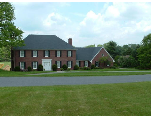 249 Rice Road Wayland, MA 01778 - Photo 2 of 26 a front view of a house with a yard