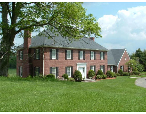 249 Rice Road Wayland, MA 01778 - Photo 24 of 26 a front view of a house with a garden