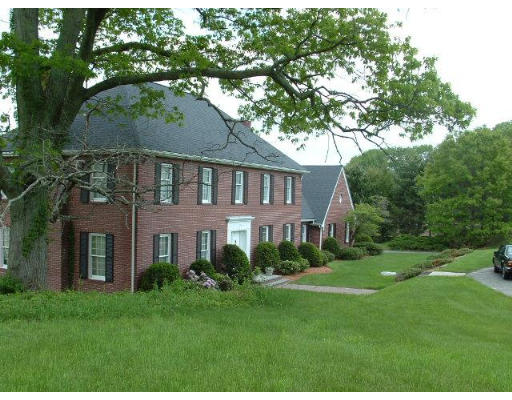 249 Rice Road Wayland, MA 01778 - Photo 3 of 26 a front view of a house with a garden