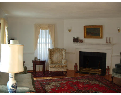 249 Rice Road Wayland, MA 01778 - Photo 4 of 26 a living room with furniture and a fireplace