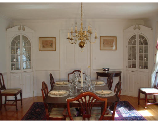 249 Rice Road Wayland, MA 01778 - Photo 6 of 26 a view of a dining room with furniture and a chandelier