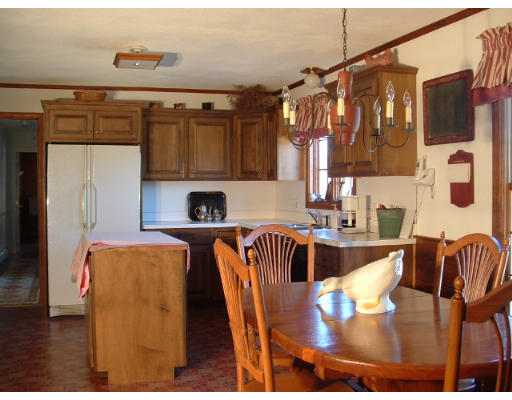 249 Rice Road Wayland, MA 01778 - Photo 8 of 26 a dining room with furniture and a floor to ceiling window