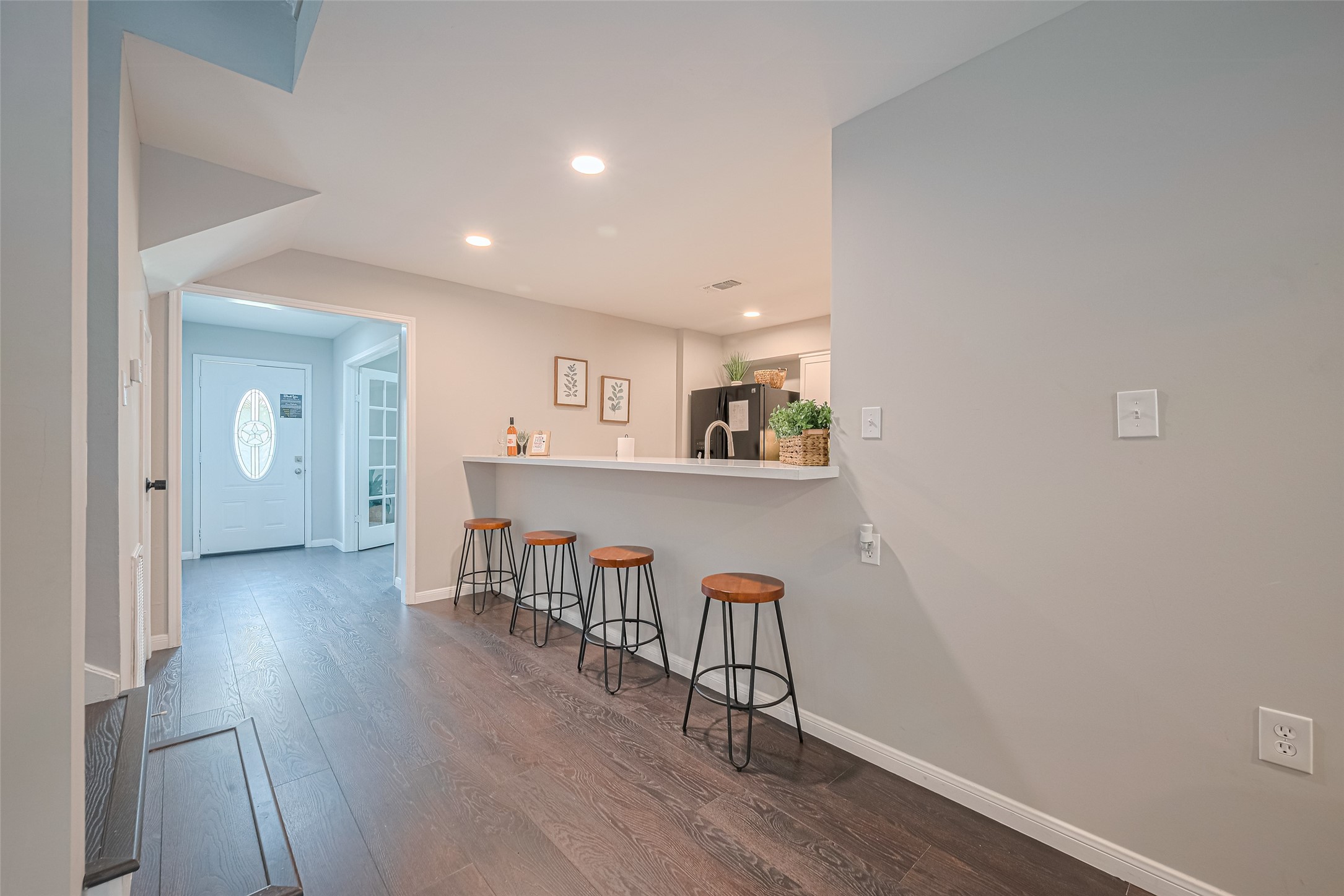 14688 Perthshire Road, Unit C Houston, TX 77079 - Photo 15 of 42 an empty room with wooden floor and windows