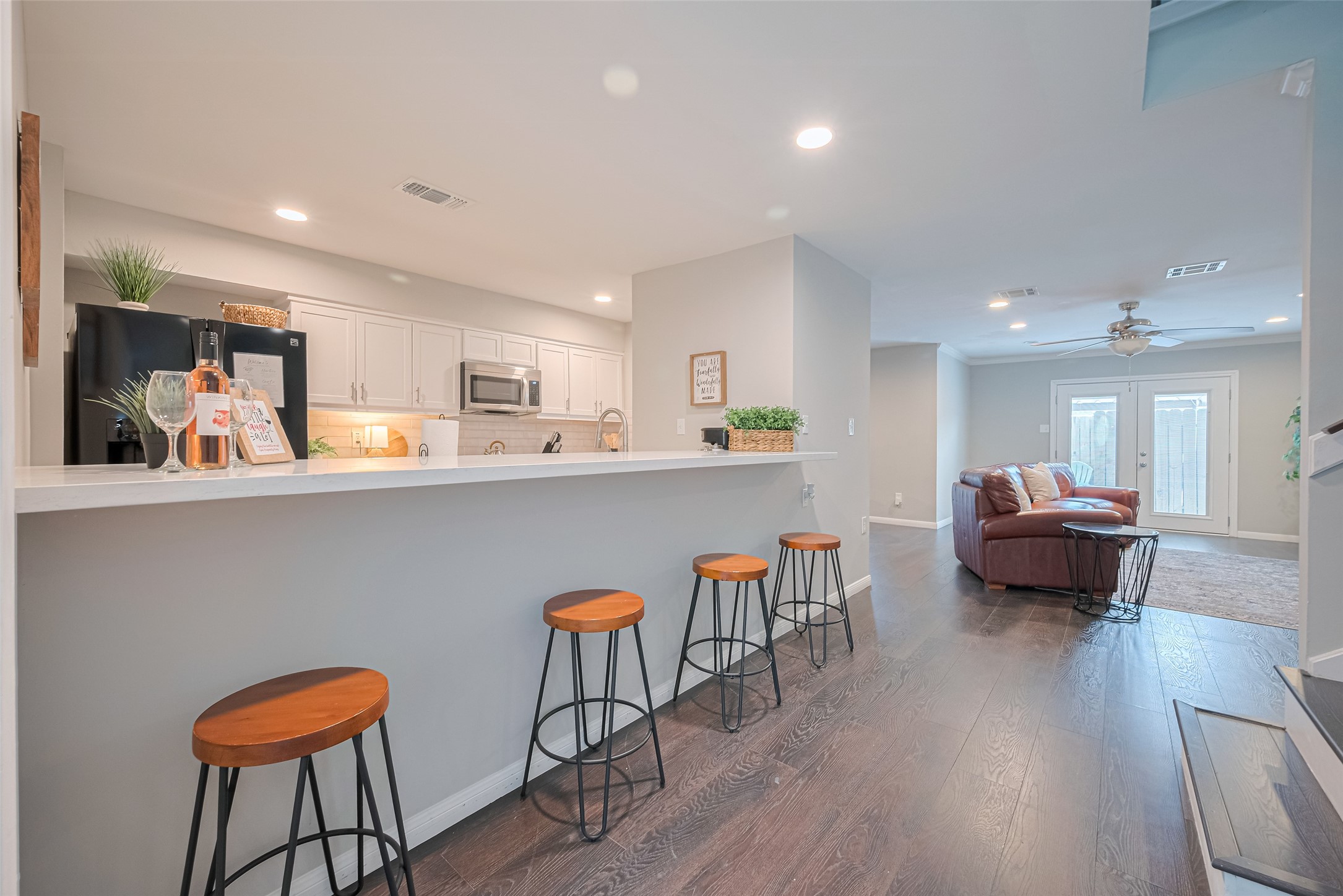 14688 Perthshire Road, Unit C Houston, TX 77079 - Photo 16 of 42 a living room with furniture and a wooden floor