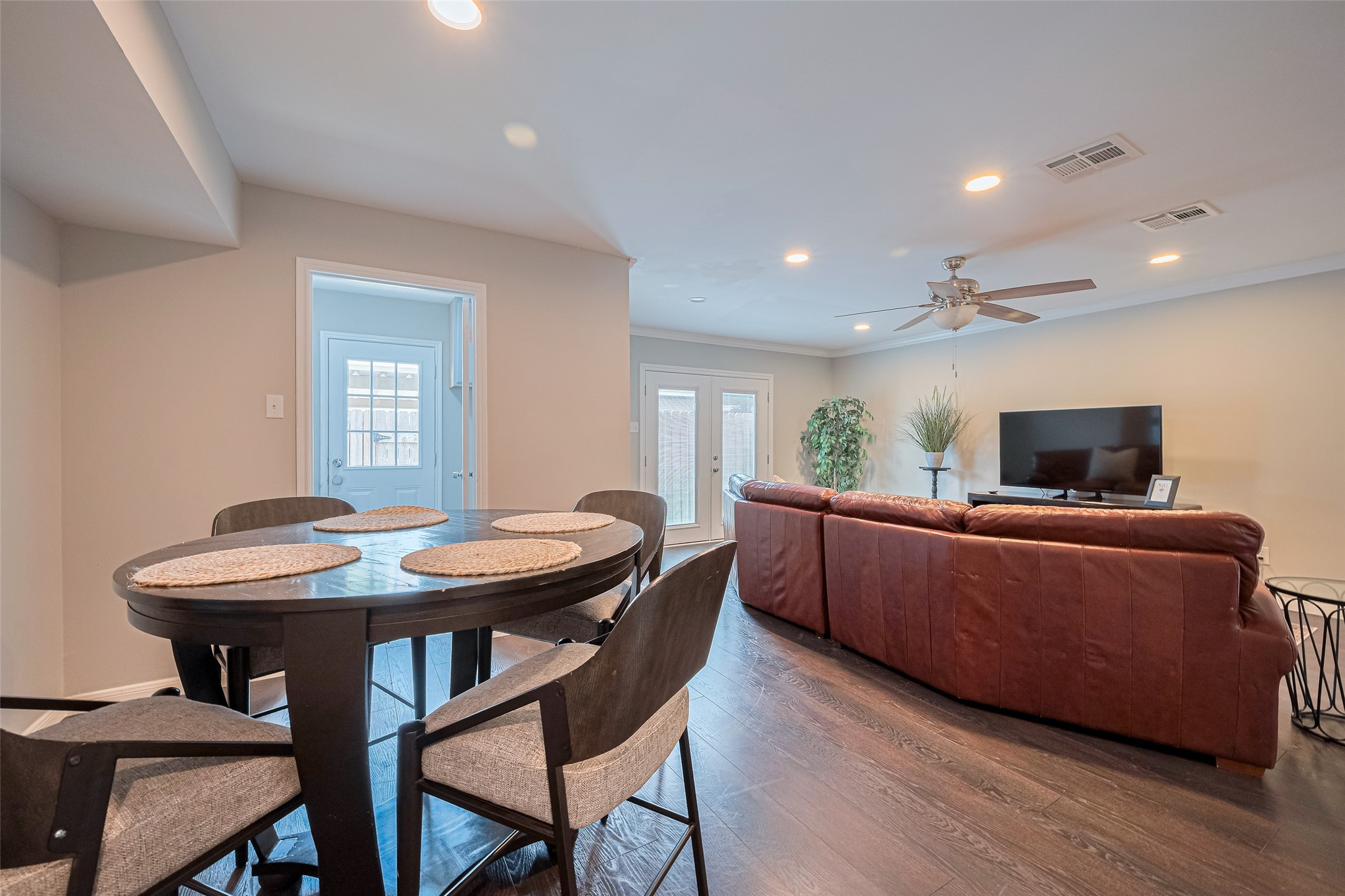 14688 Perthshire Road, Unit C Houston, TX 77079 - Photo 17 of 42 a living room with furniture and a flat screen tv