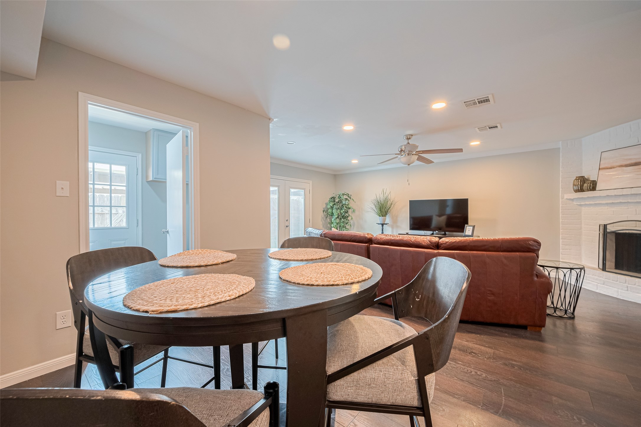 14688 Perthshire Road, Unit C Houston, TX 77079 - Photo 18 of 42 a view of a dining room with furniture and wooden floor