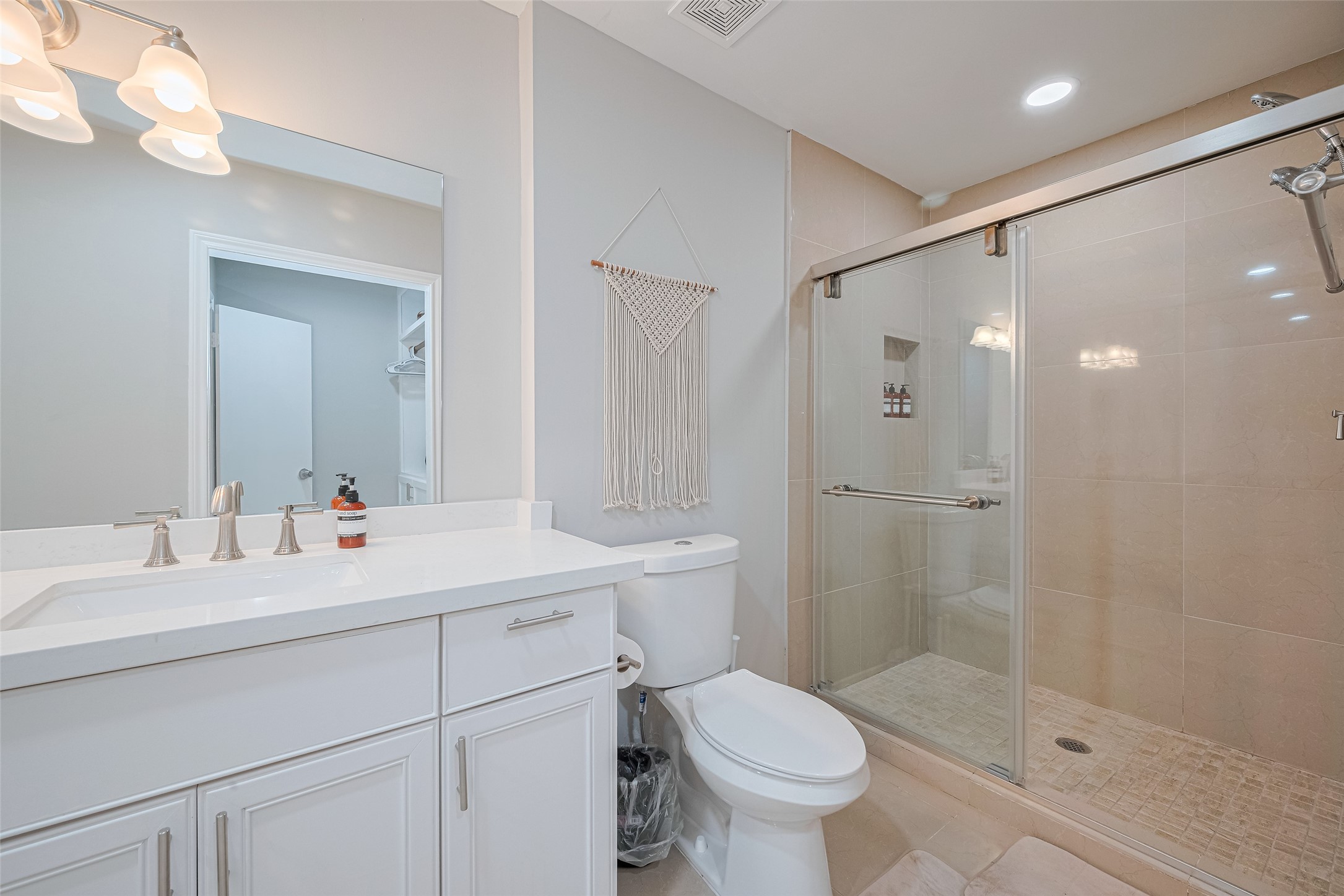 14688 Perthshire Road, Unit C Houston, TX 77079 - Photo 25 of 42 a bathroom with a sink mirror toilet and shower