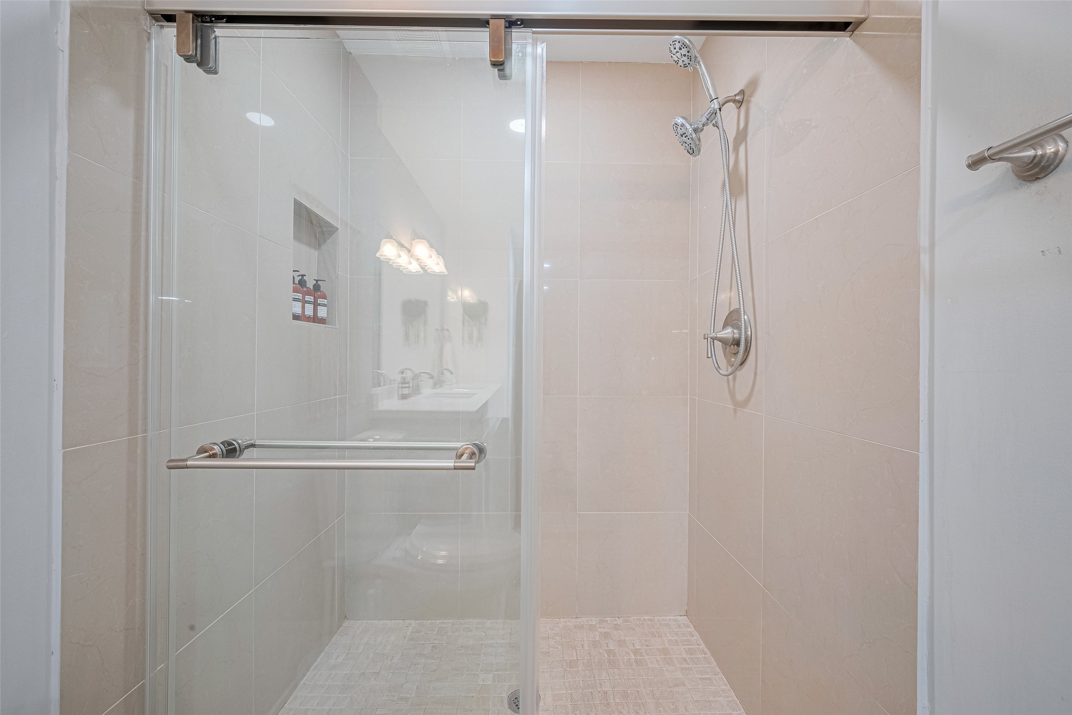 14688 Perthshire Road, Unit C Houston, TX 77079 - Photo 26 of 42 a bathroom with a glass shower door