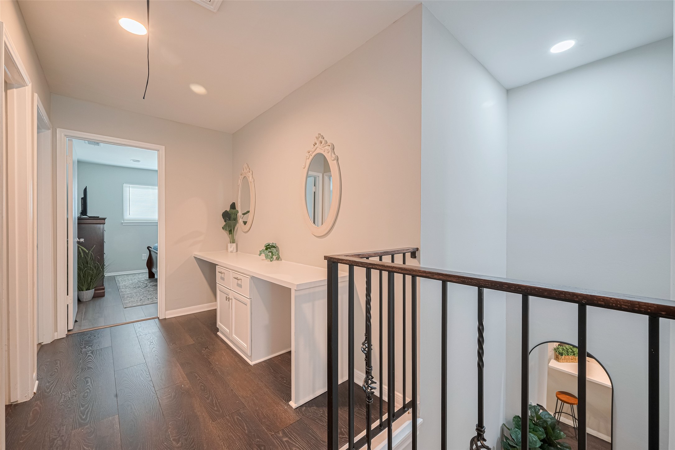 14688 Perthshire Road, Unit C Houston, TX 77079 - Photo 29 of 42 a view of a hallway with wooden floor and windows