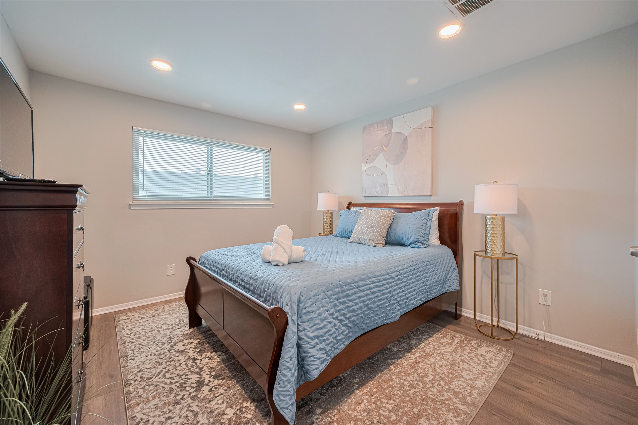 14688 Perthshire Road, Unit C Houston, TX 77079 - Photo 31 of 42 a bedroom with bed and window