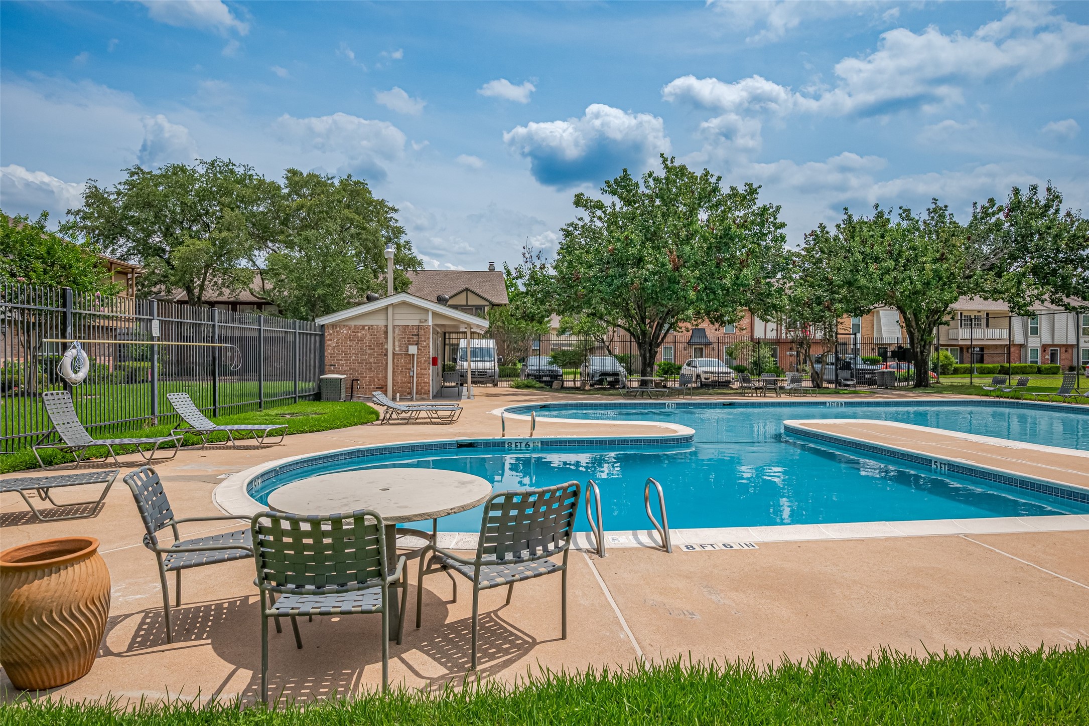 14688 Perthshire Road, Unit C Houston, TX 77079 - Photo 41 of 42 a patio with swimming pool table and chairs