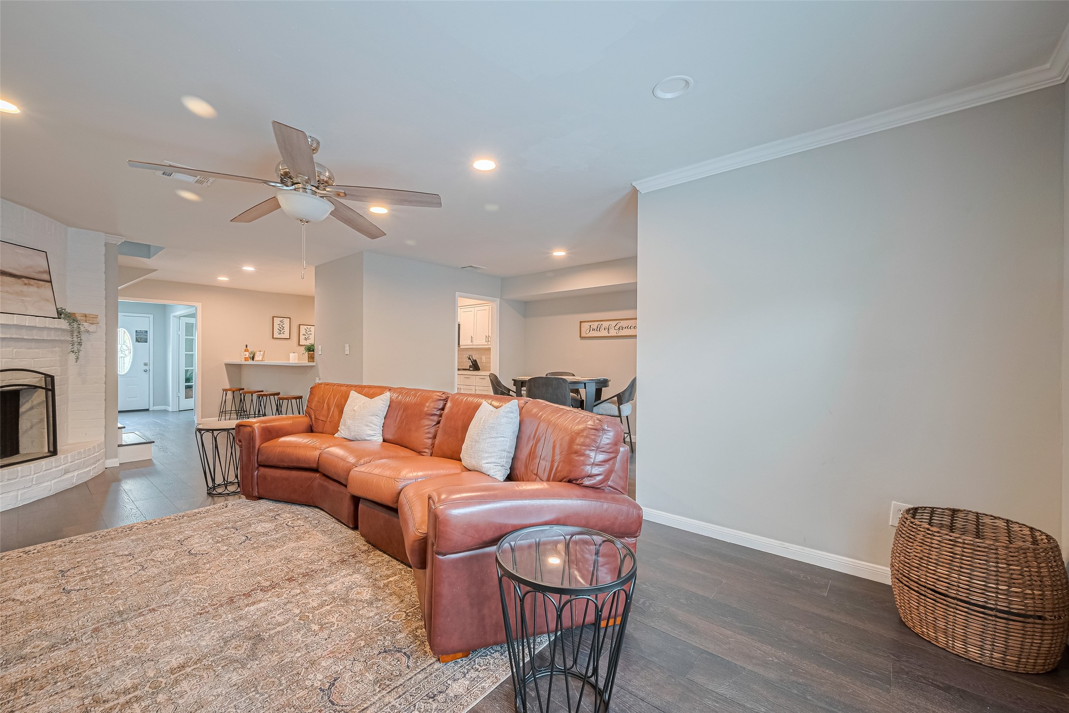 14688 Perthshire Road, Unit C Houston, TX 77079 - Photo 7 of 42 a view of living room kitchen with furniture and wooden floor