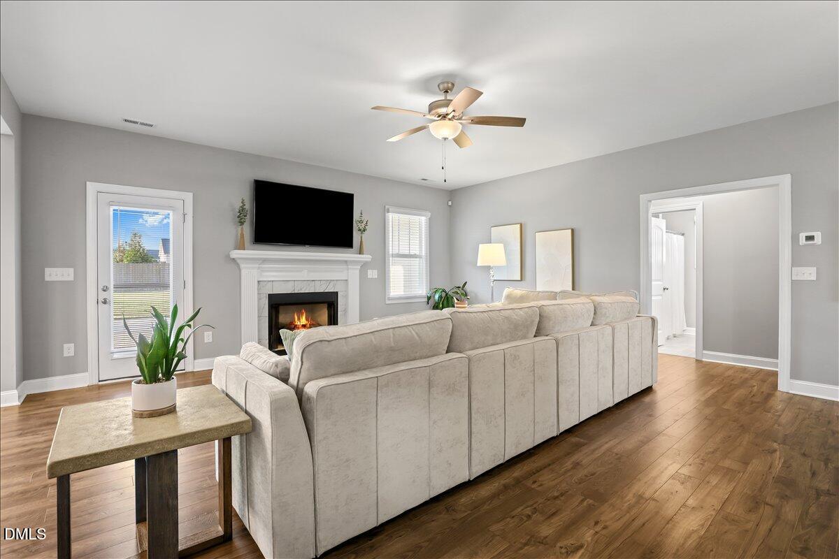 88 Heath Road Lillington, NC 27546 - Photo 31 of 54 a living room with furniture fireplace and a flat screen tv