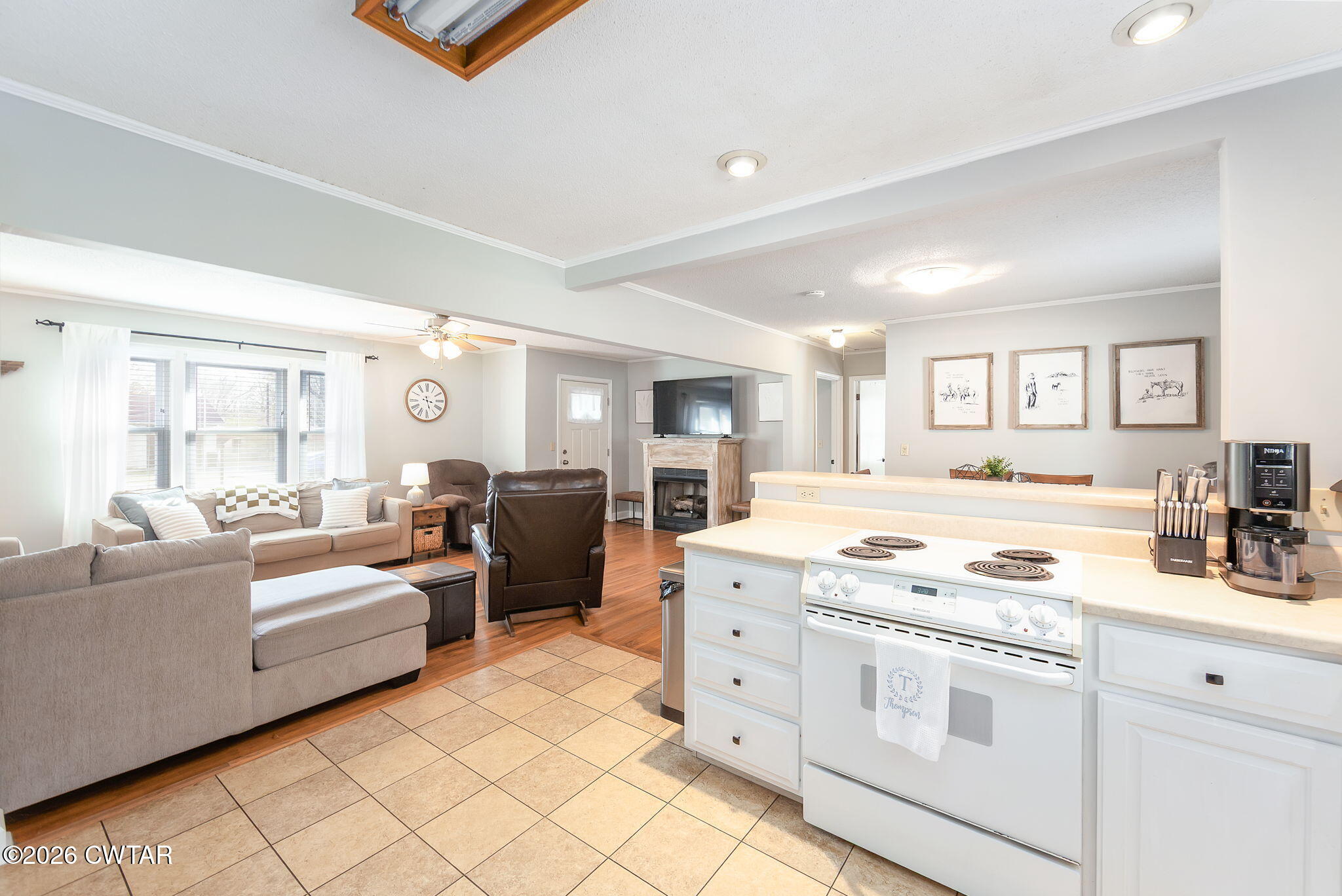 31 Mack Street Jackson, TN 38305 - Photo 14 of 23 a kitchen with white cabinets and appliances