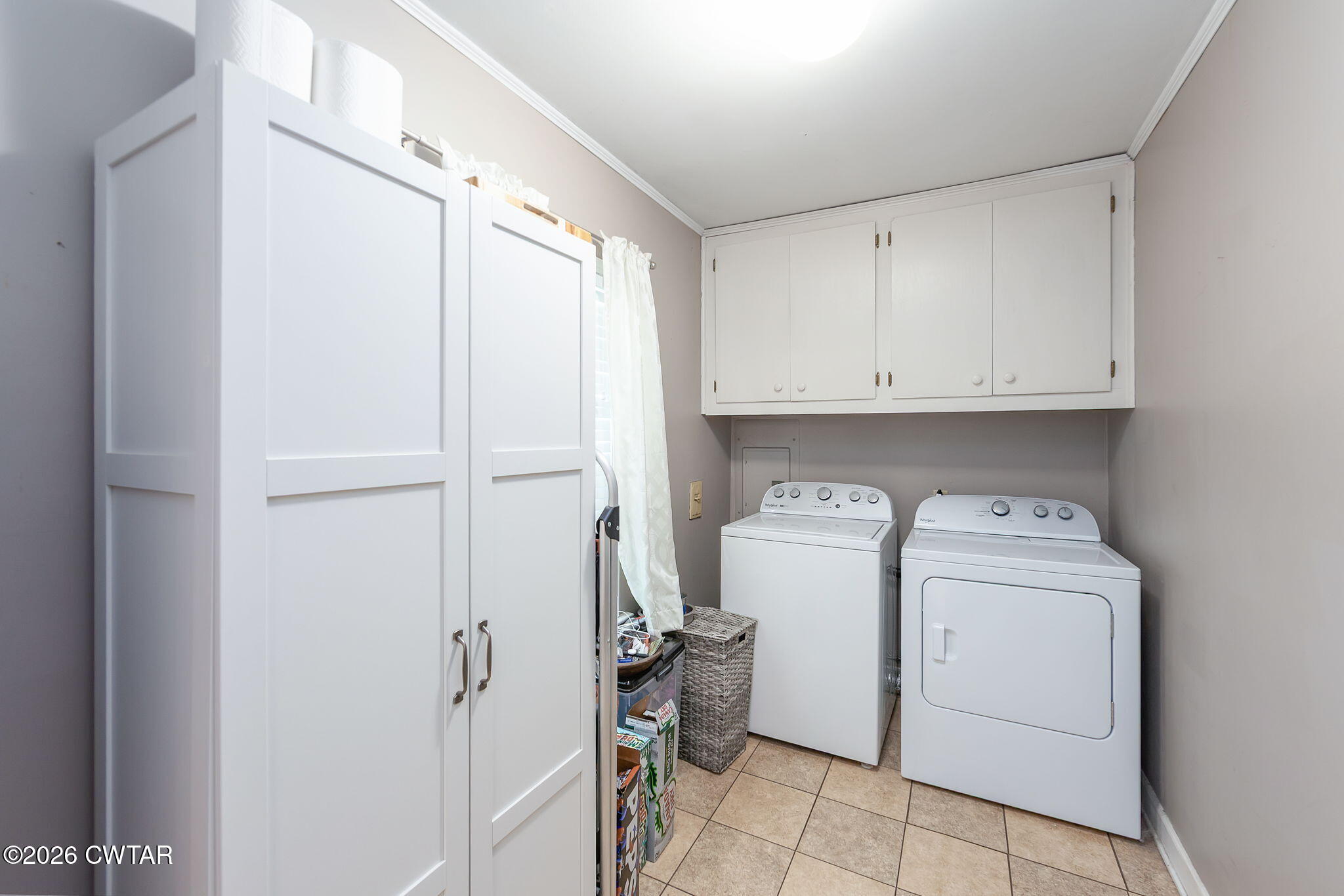 31 Mack Street Jackson, TN 38305 - Photo 15 of 23 a view of storage and utility room with washer and dryer