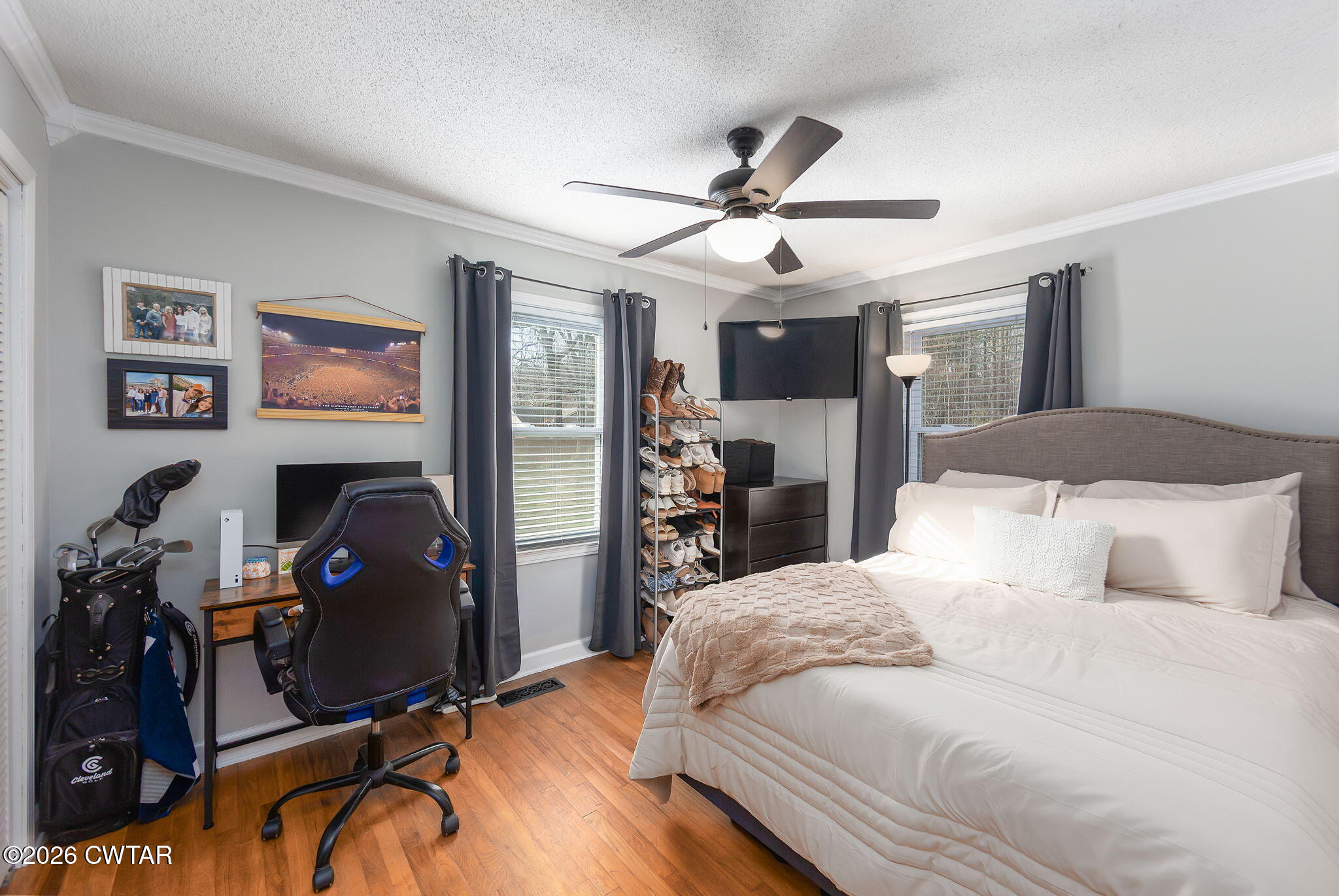 31 Mack Street Jackson, TN 38305 - Photo 17 of 23 a bedroom with a bed and wooden floor