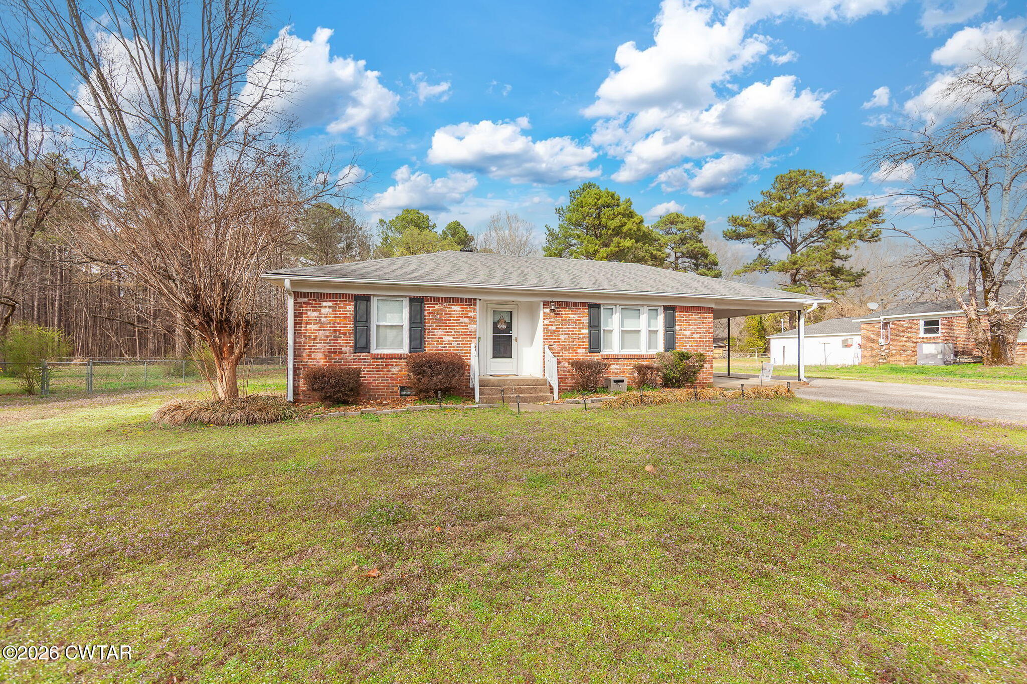 31 Mack Street Jackson, TN 38305 - Photo 2 of 23 a front view of a house with a garden and trees